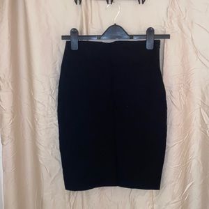 Black pencil skirt with bow on the back